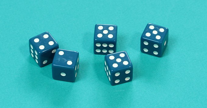 Five dice showing fives four and two