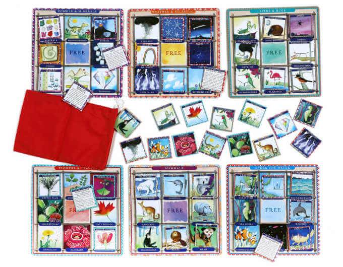 four colorful bingo boards and cards with red bag