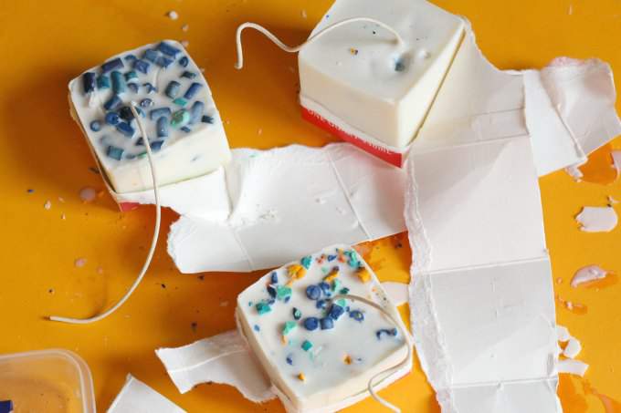 Peel away paper from milk carton candles