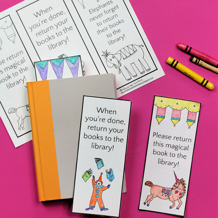 Paper library bookmarks with book and crayons