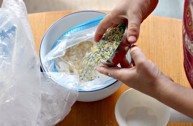 Pouring ingredients for ice cream in a bag.