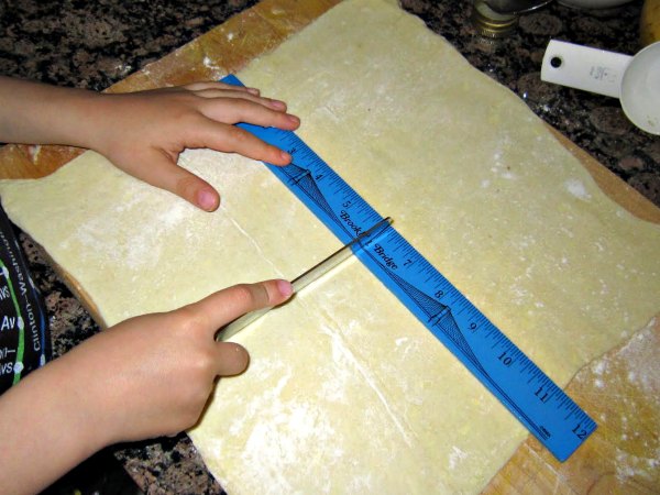 Measuring dough is good math practice for kids in the kitchen