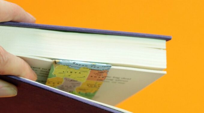 Open book with map decorated bookmark