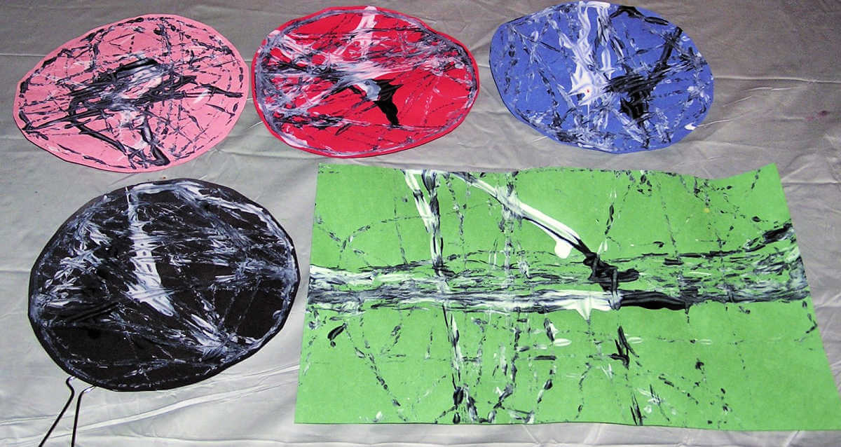 Selection of different colors of abstract art made by painting with marbles