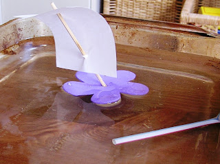 DIY sailboat on water in baking tray