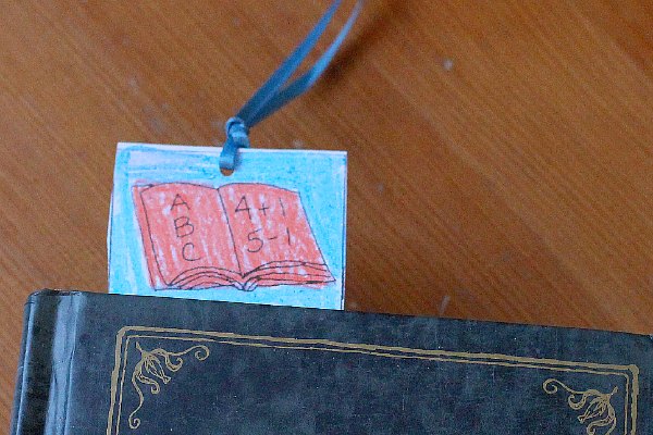 School bookmark in book. 