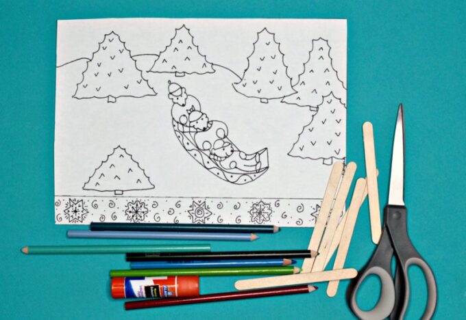 sledding coloring page with scissors, crayons and glue on blue background