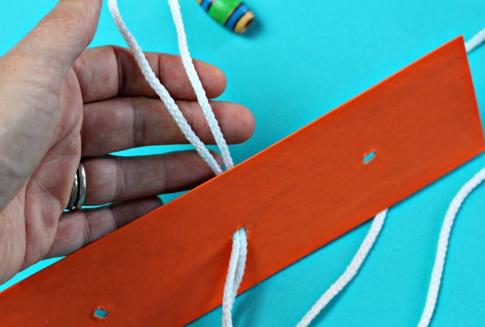 String and bead puzzle instructions loop.