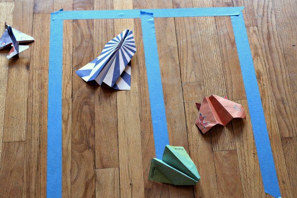 Tape landing strip for paper airplane games.
