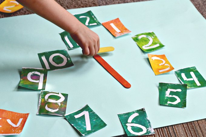 Playing a game for teachings kids to tell time.