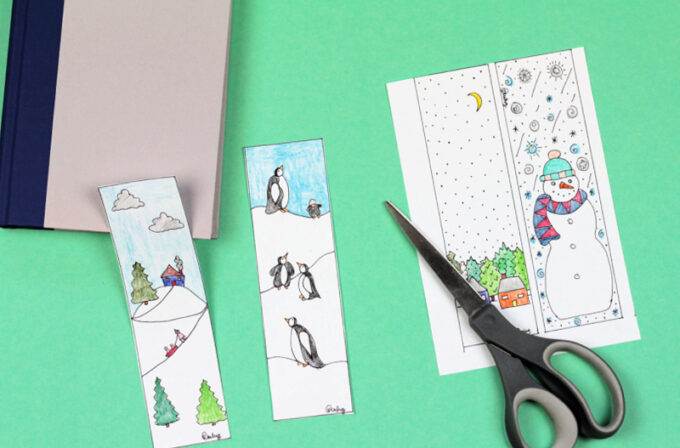 winter bookmark coloring page cut in half with scissors and book